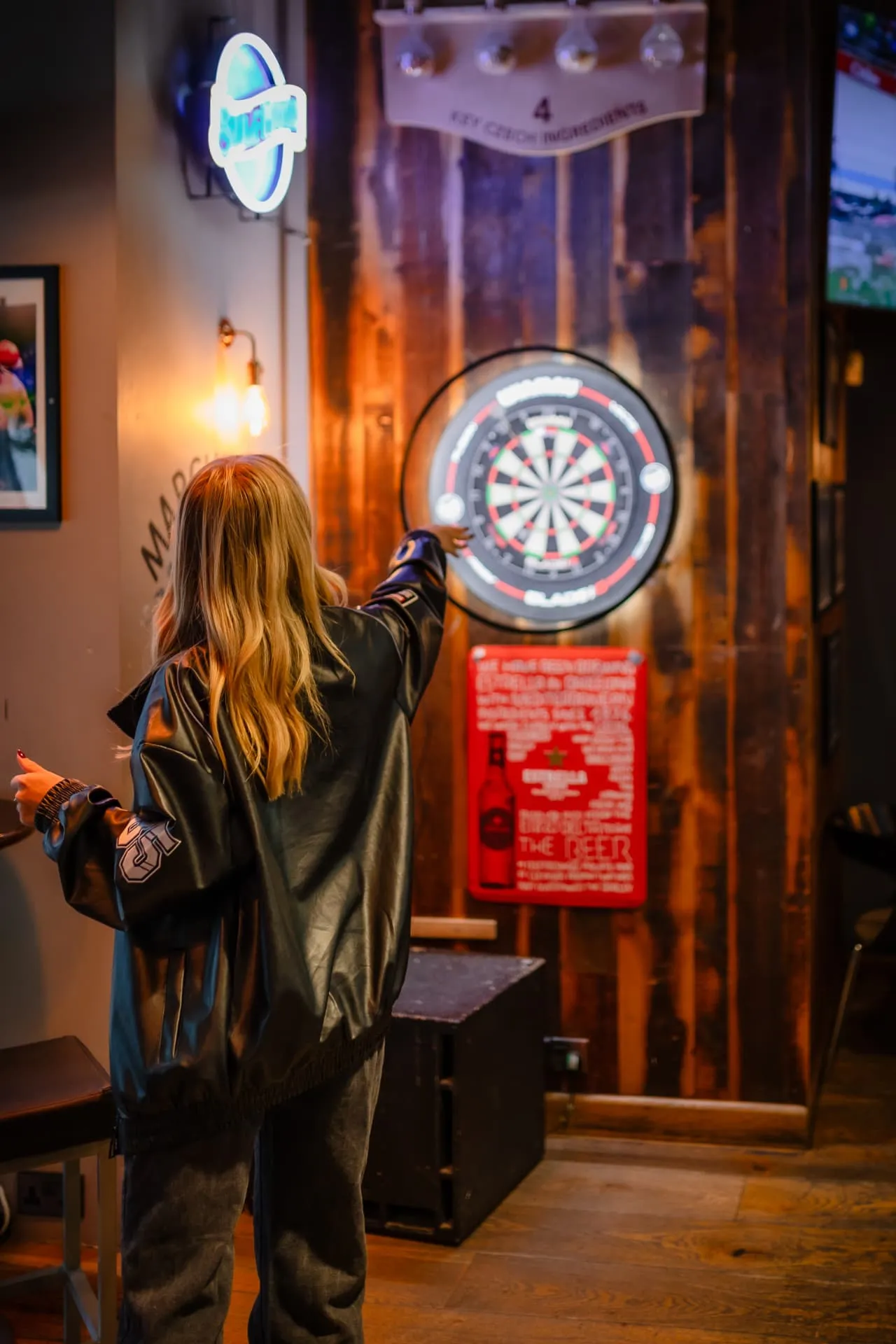 Playing darts at Toast Leeds