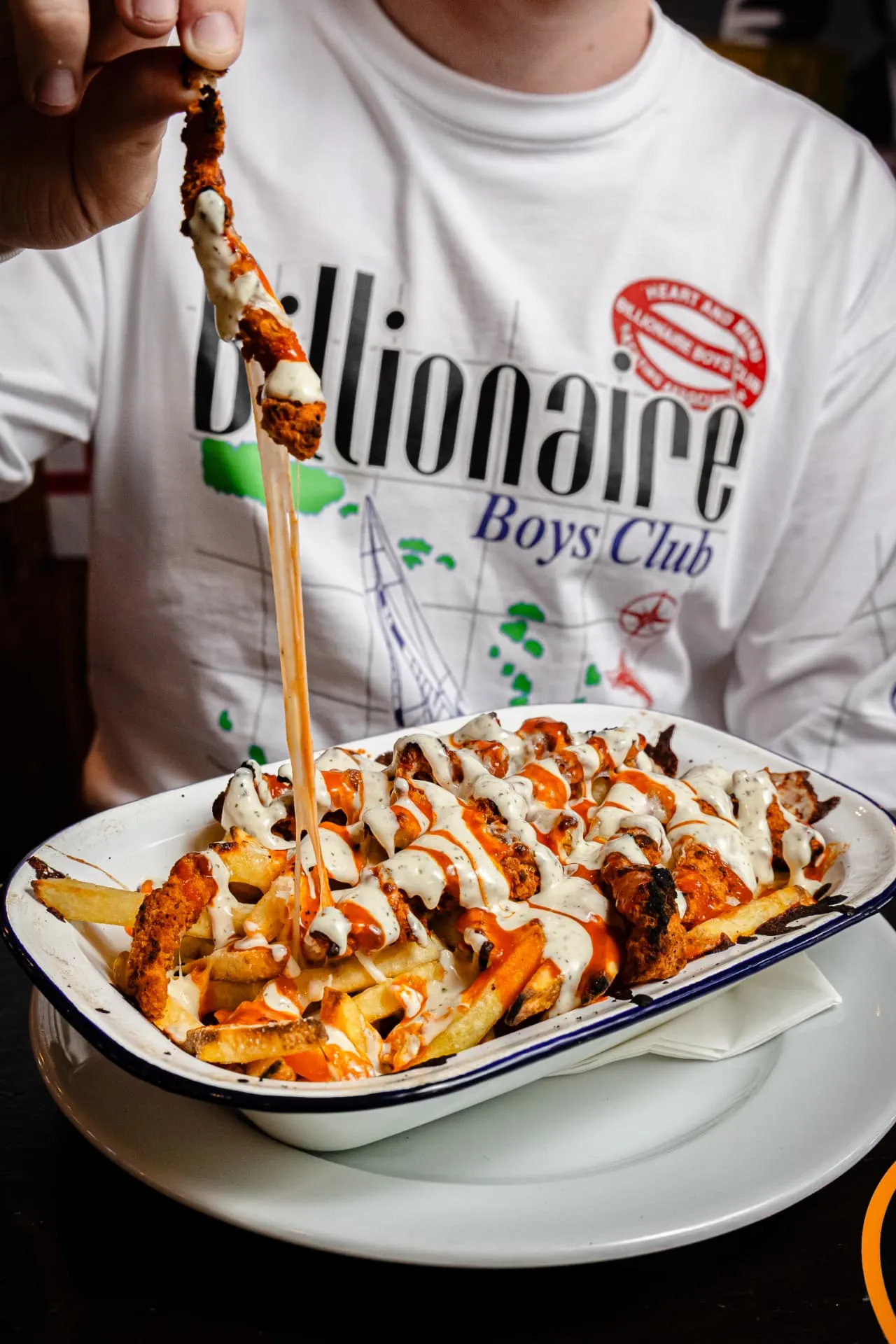 Loaded fries with chicken and sauces at Toast Leeds